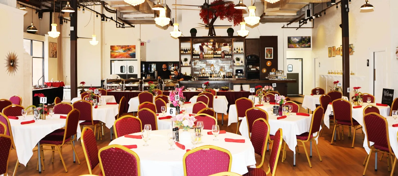 Sunday brunch dining room at The Venue Clermont with round tables, chandeliers, and buffet stations